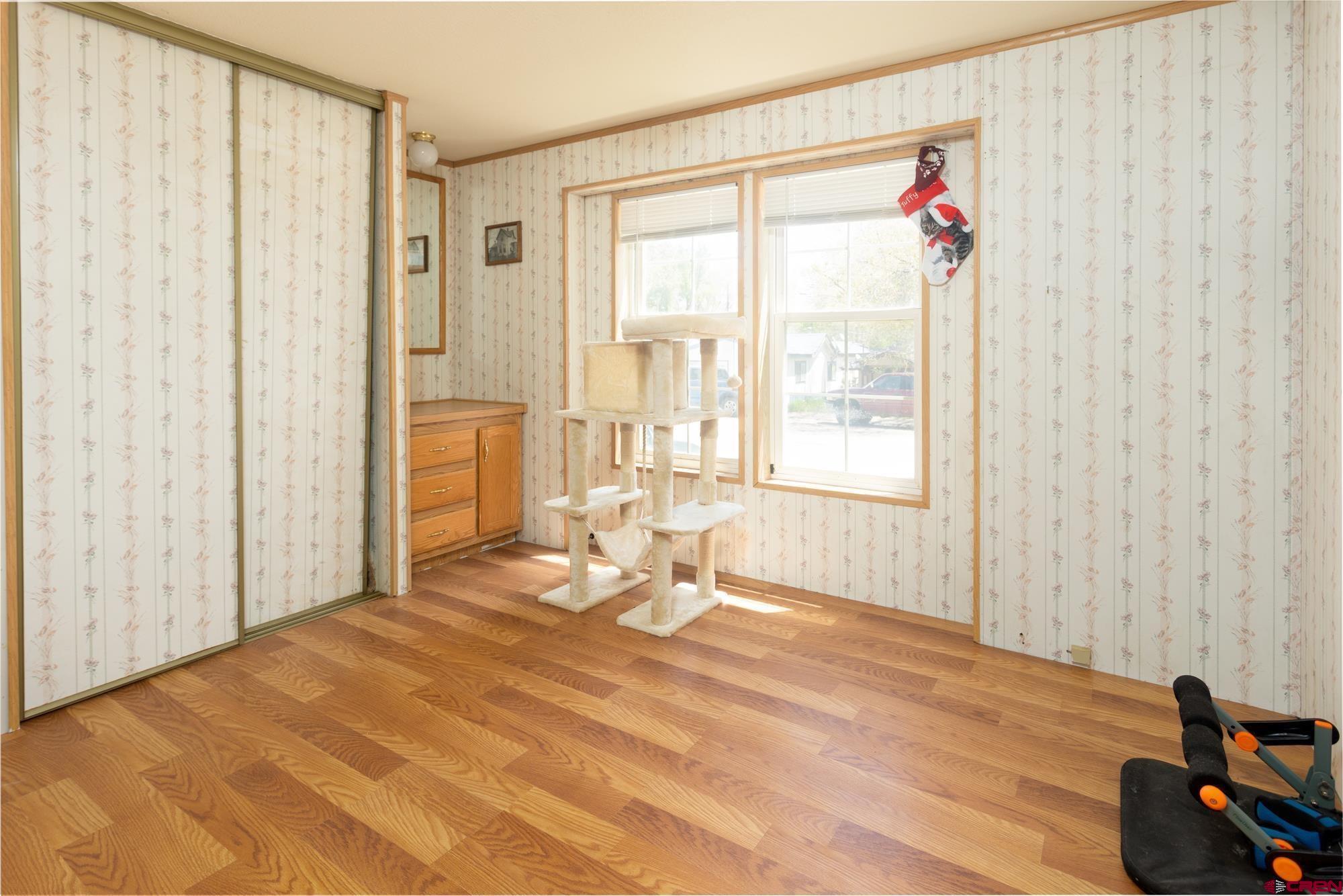 875 Browning Avenue Ignacio, CO 81137 - Photo 18 of 24 a bedroom with a bed and a window