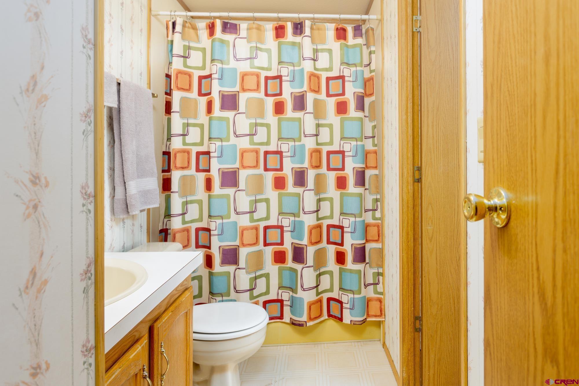 875 Browning Avenue Ignacio, CO 81137 - Photo 19 of 24 a bathroom with a bathtub and a toilet