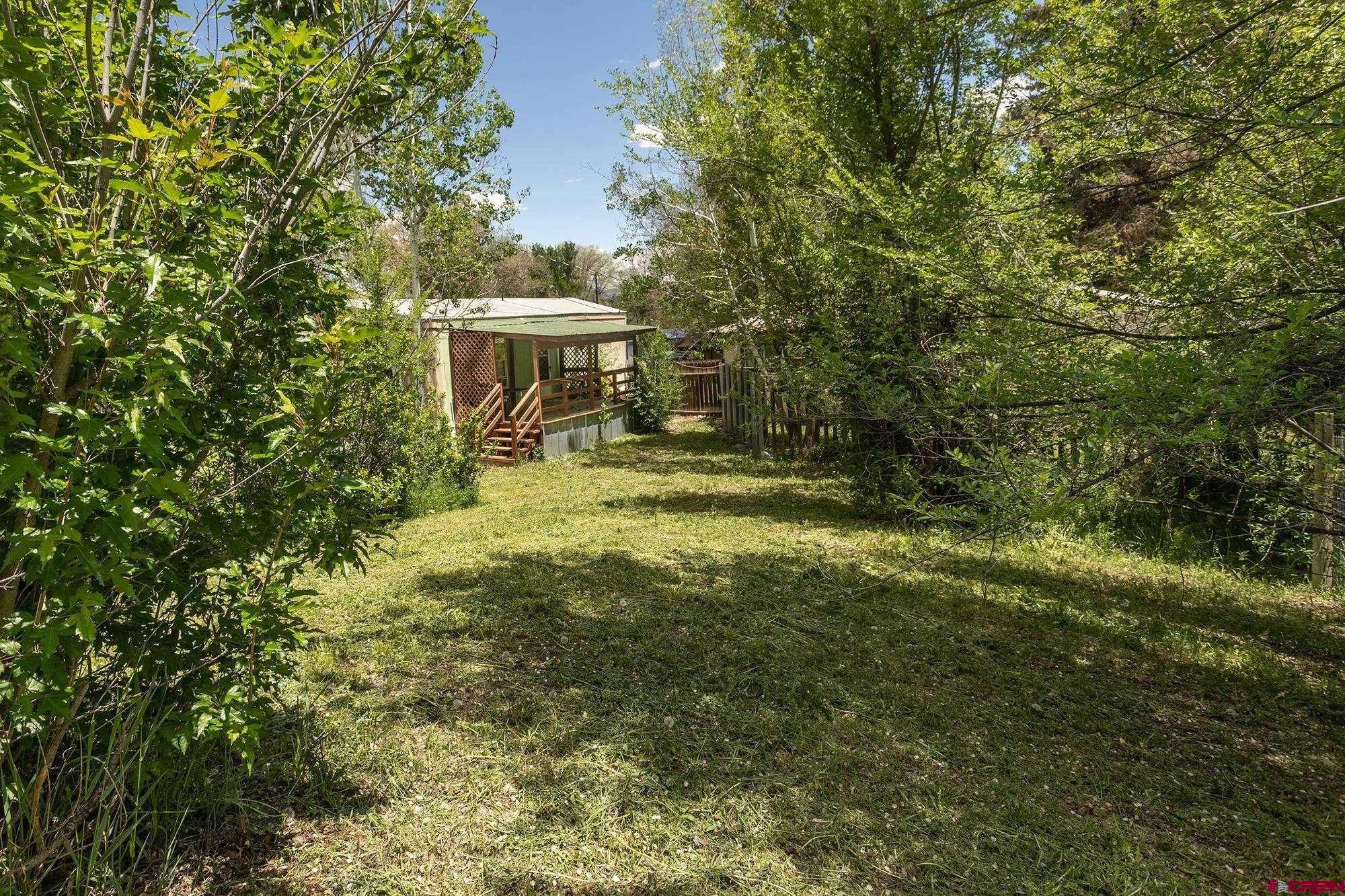 875 Browning Avenue Ignacio, CO 81137 - Photo 22 of 24 a view of a big yard with large trees