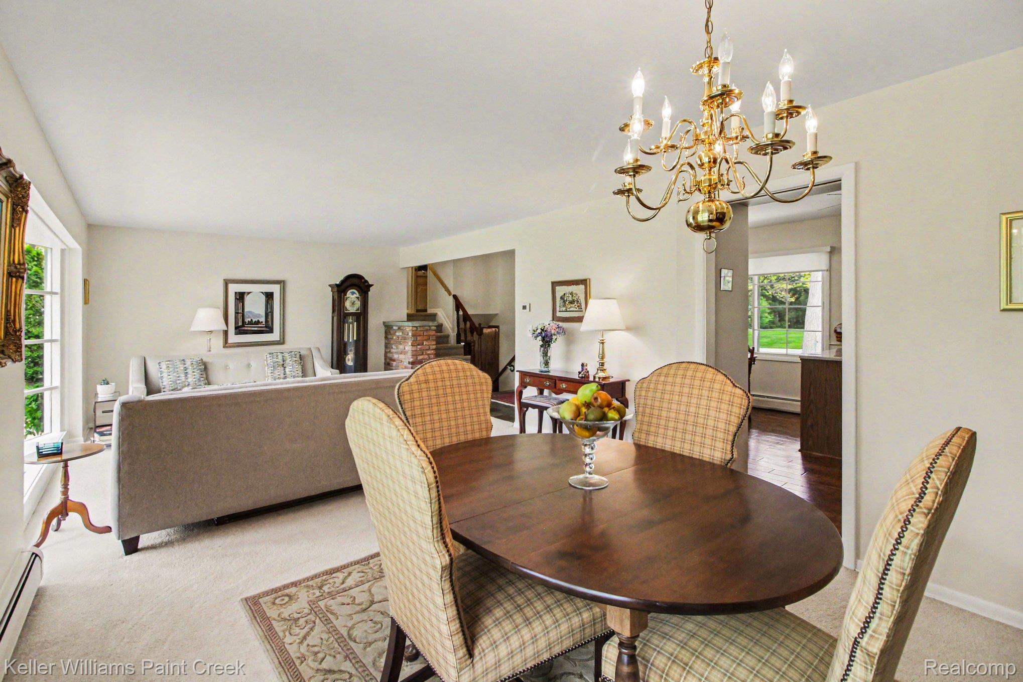 3370 Aquinas Drive Rochester, MI 48309 - Photo 5 of 25 Dining space featuring light carpet, a chandelier, and baseboard heating