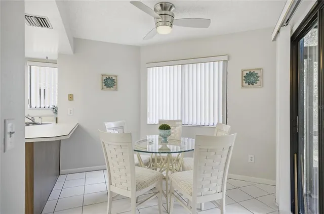 a kitchen with a sink stove top oven and cabinets