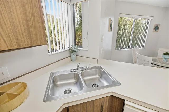 a kitchen with a stove and a refrigerator