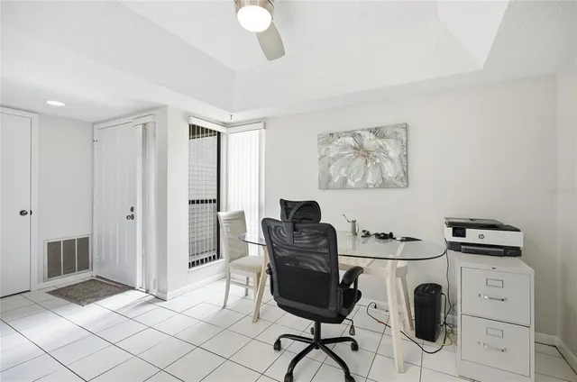 a living room with furniture rug and wooden floor