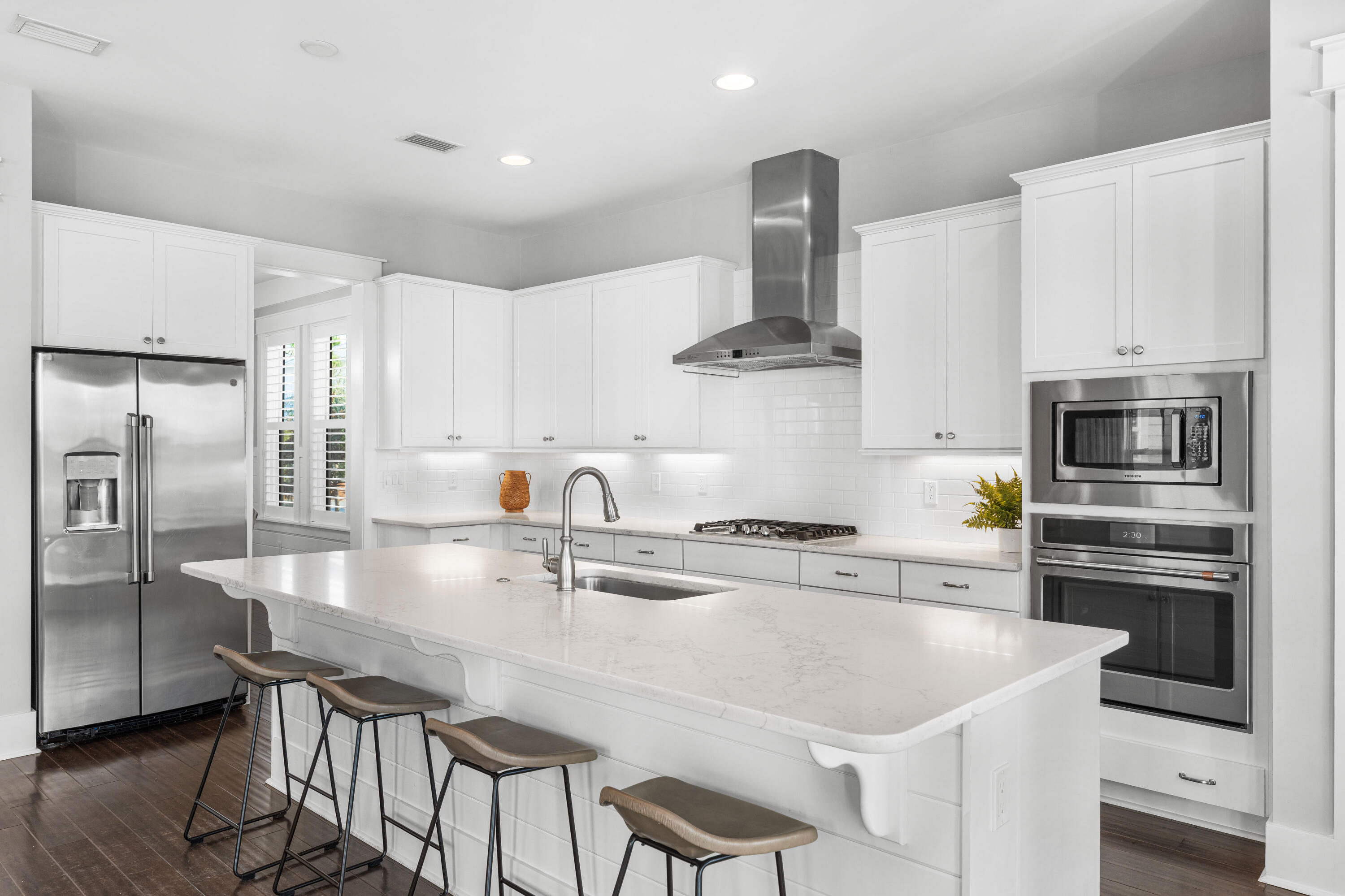 1085 Sandgrass Boulevard Santa Rosa Beach, FL 32459 - Photo 13 of 62 a kitchen with stainless steel appliances granite countertop a sink a stove a refrigerator and island