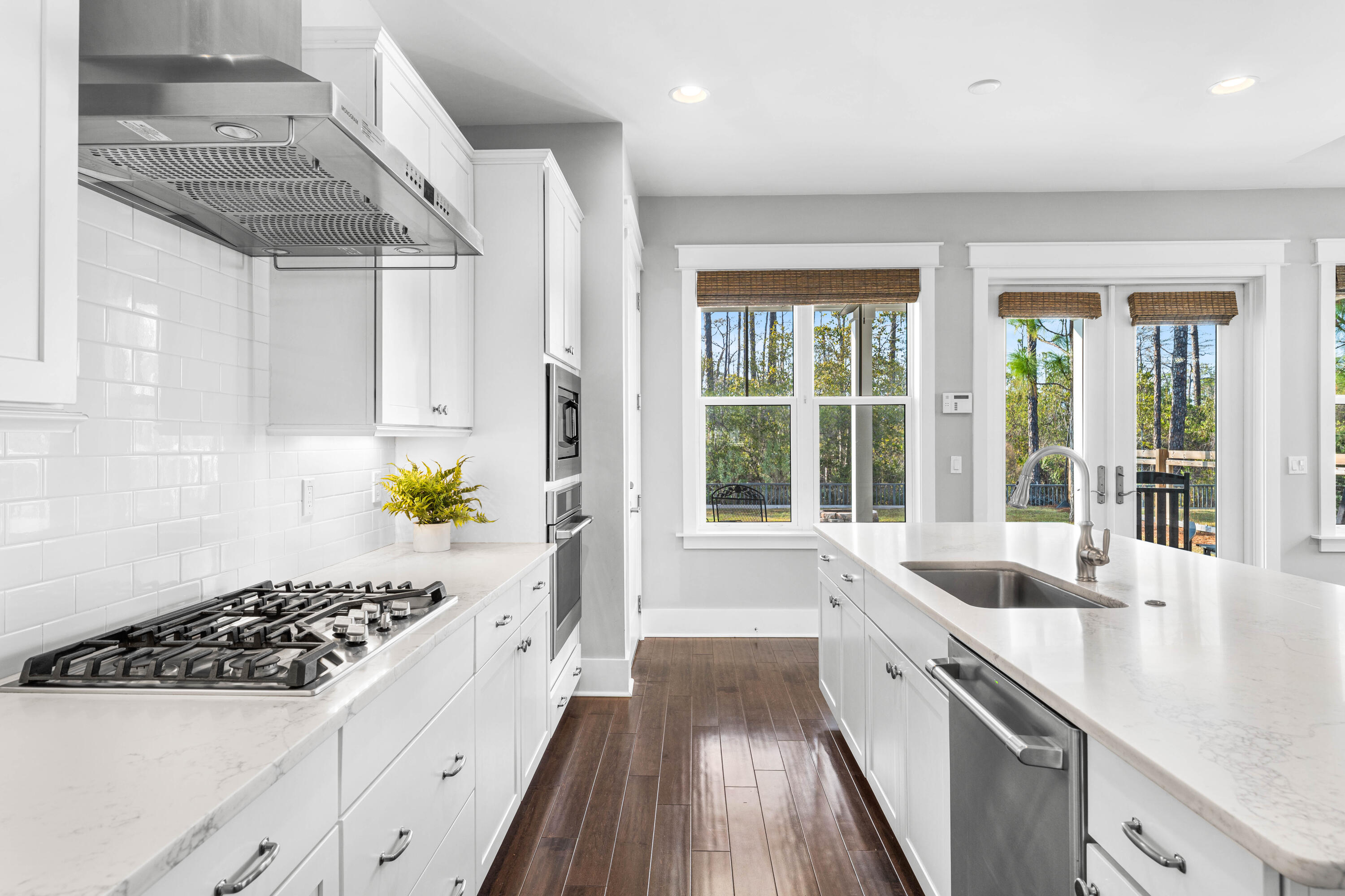 1085 Sandgrass Boulevard Santa Rosa Beach, FL 32459 - Photo 16 of 62 a kitchen with a sink a counter top space and stainless steel appliances