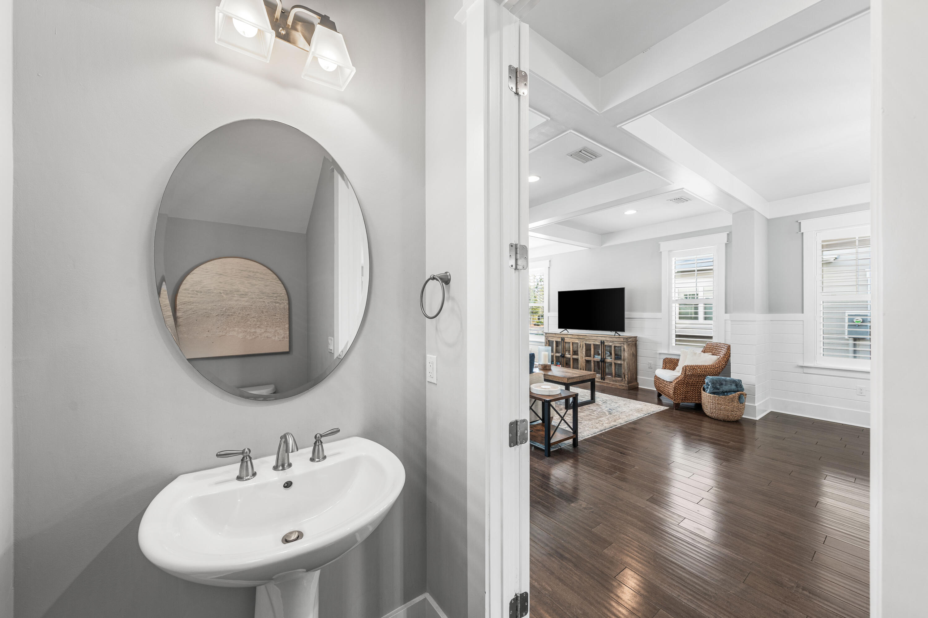 1085 Sandgrass Boulevard Santa Rosa Beach, FL 32459 - Photo 21 of 62 a living room with furniture and a wooden floor