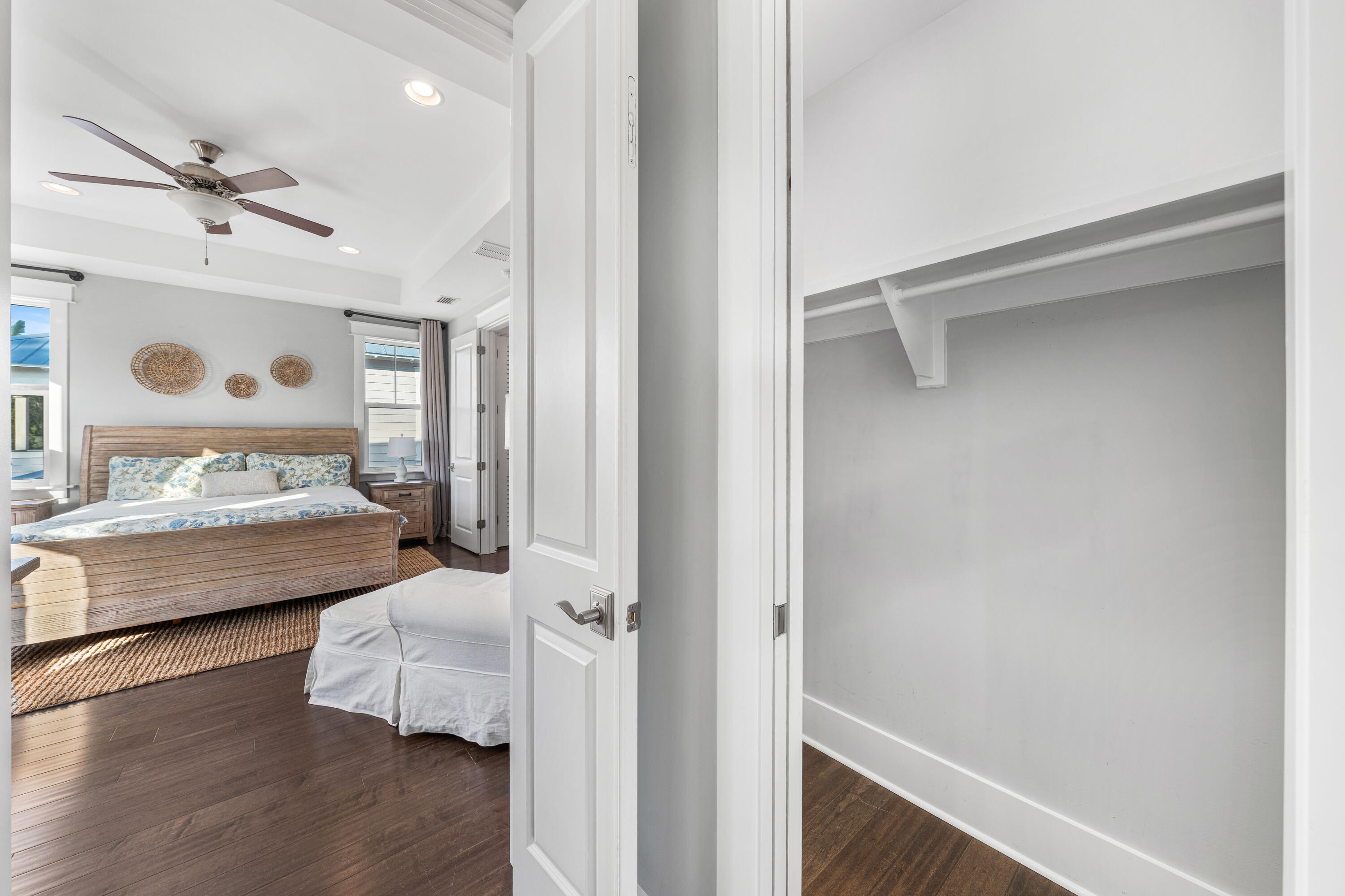 1085 Sandgrass Boulevard Santa Rosa Beach, FL 32459 - Photo 28 of 62 a bedroom with a bed and wooden floor