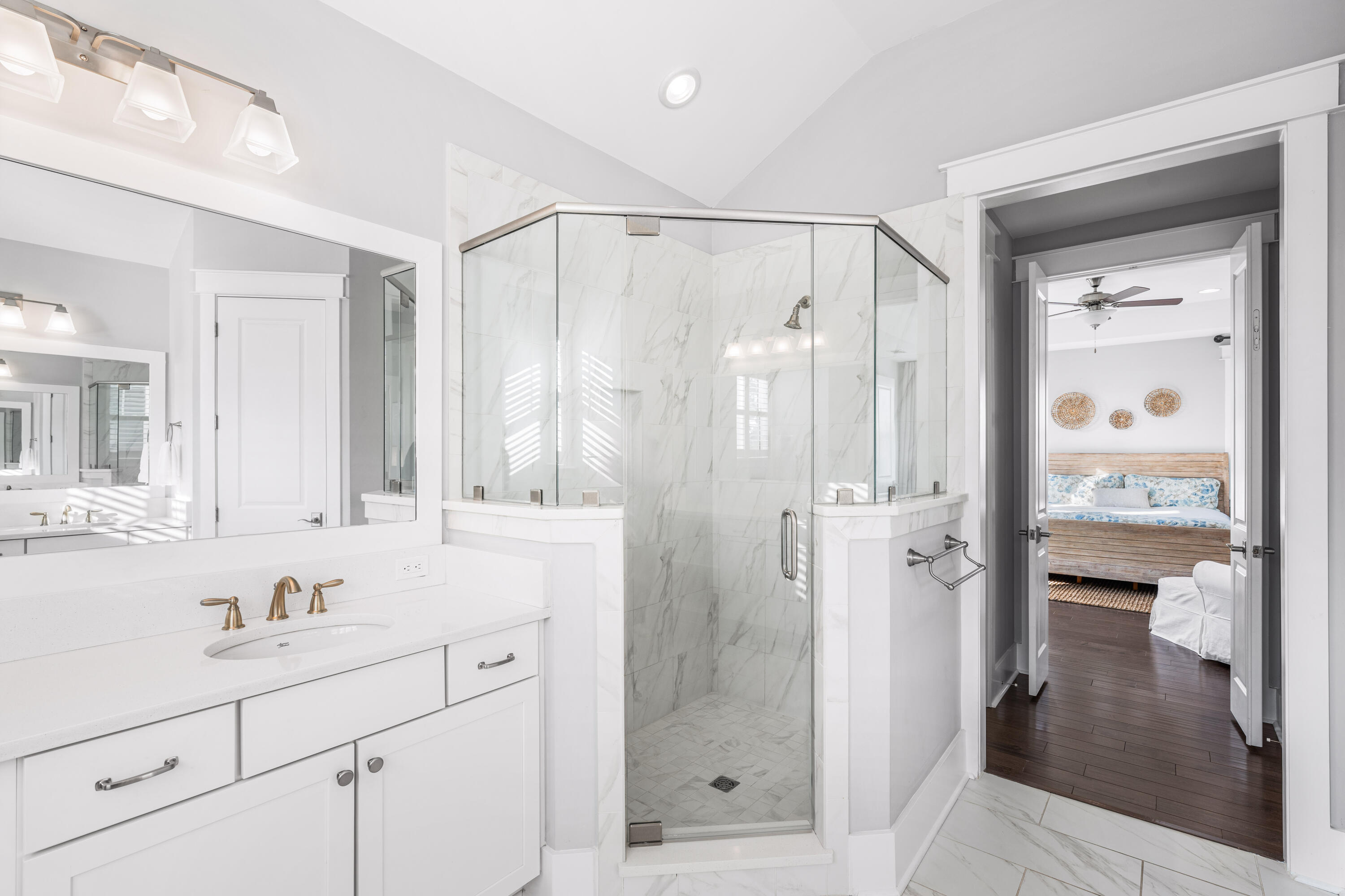 1085 Sandgrass Boulevard Santa Rosa Beach, FL 32459 - Photo 29 of 62 a bathroom with a shower sink and mirror