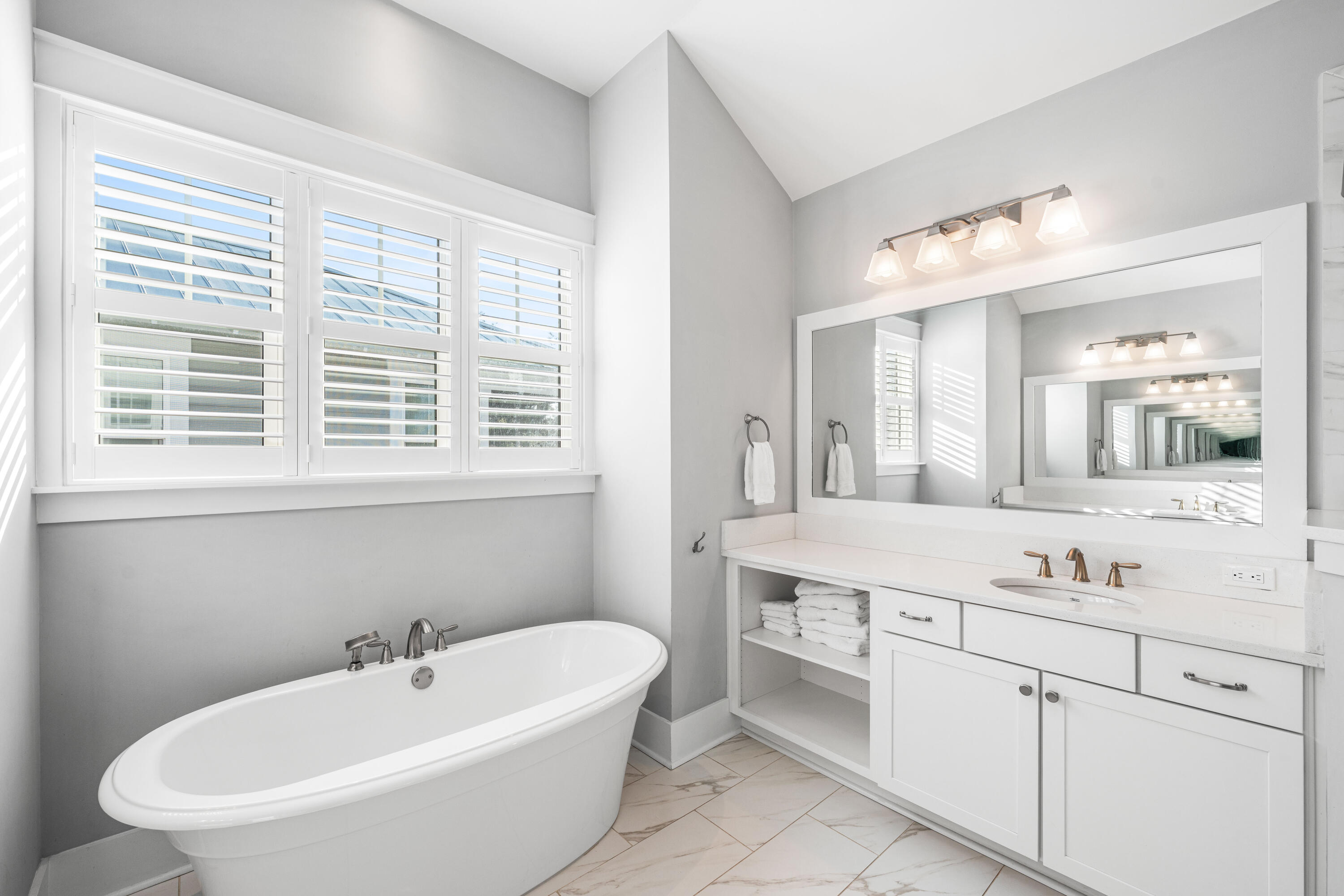 1085 Sandgrass Boulevard Santa Rosa Beach, FL 32459 - Photo 31 of 62 a bathroom with a sink and a bathtub