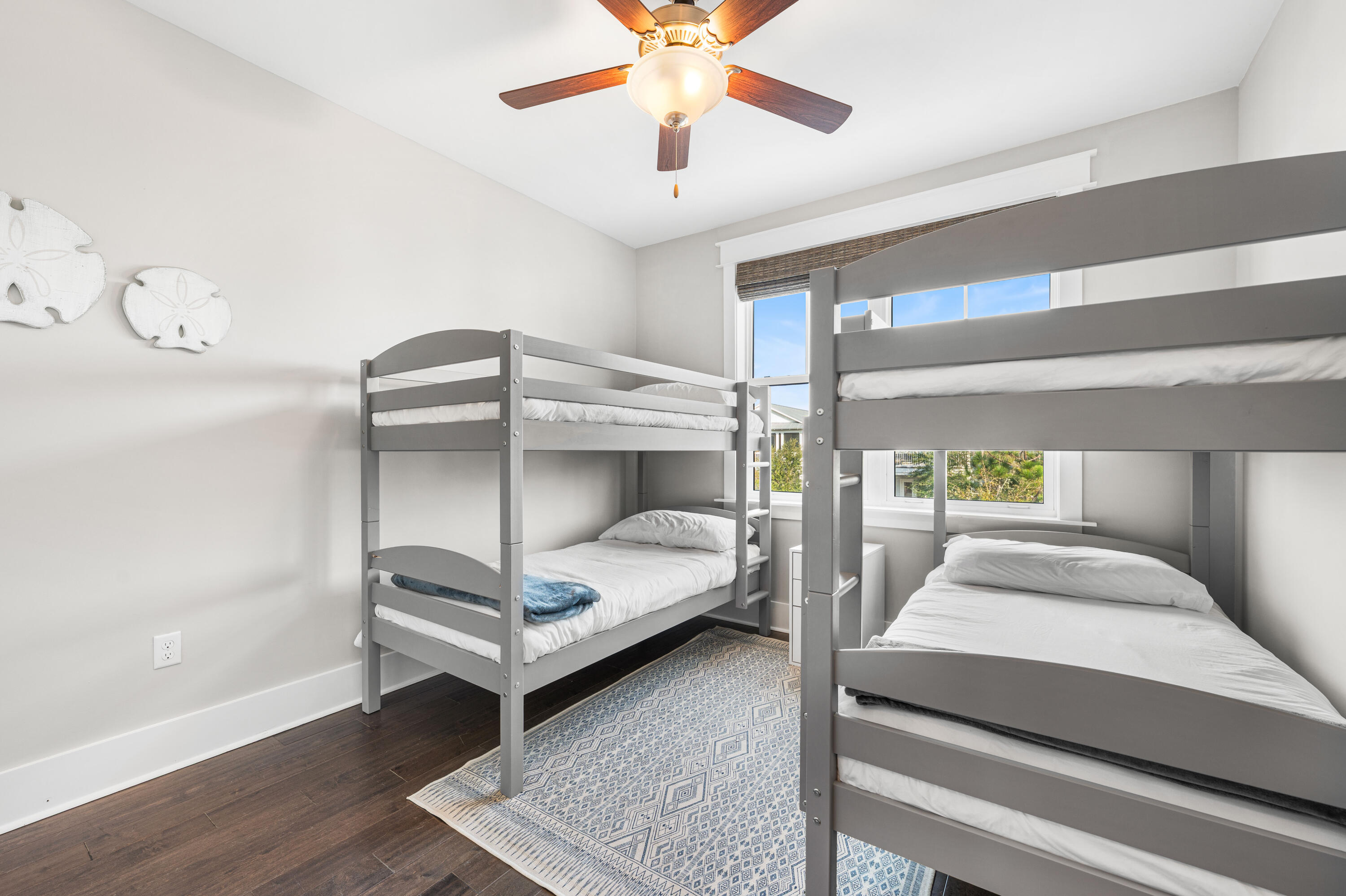 1085 Sandgrass Boulevard Santa Rosa Beach, FL 32459 - Photo 41 of 62 a bedroom with a bed and a chandelier