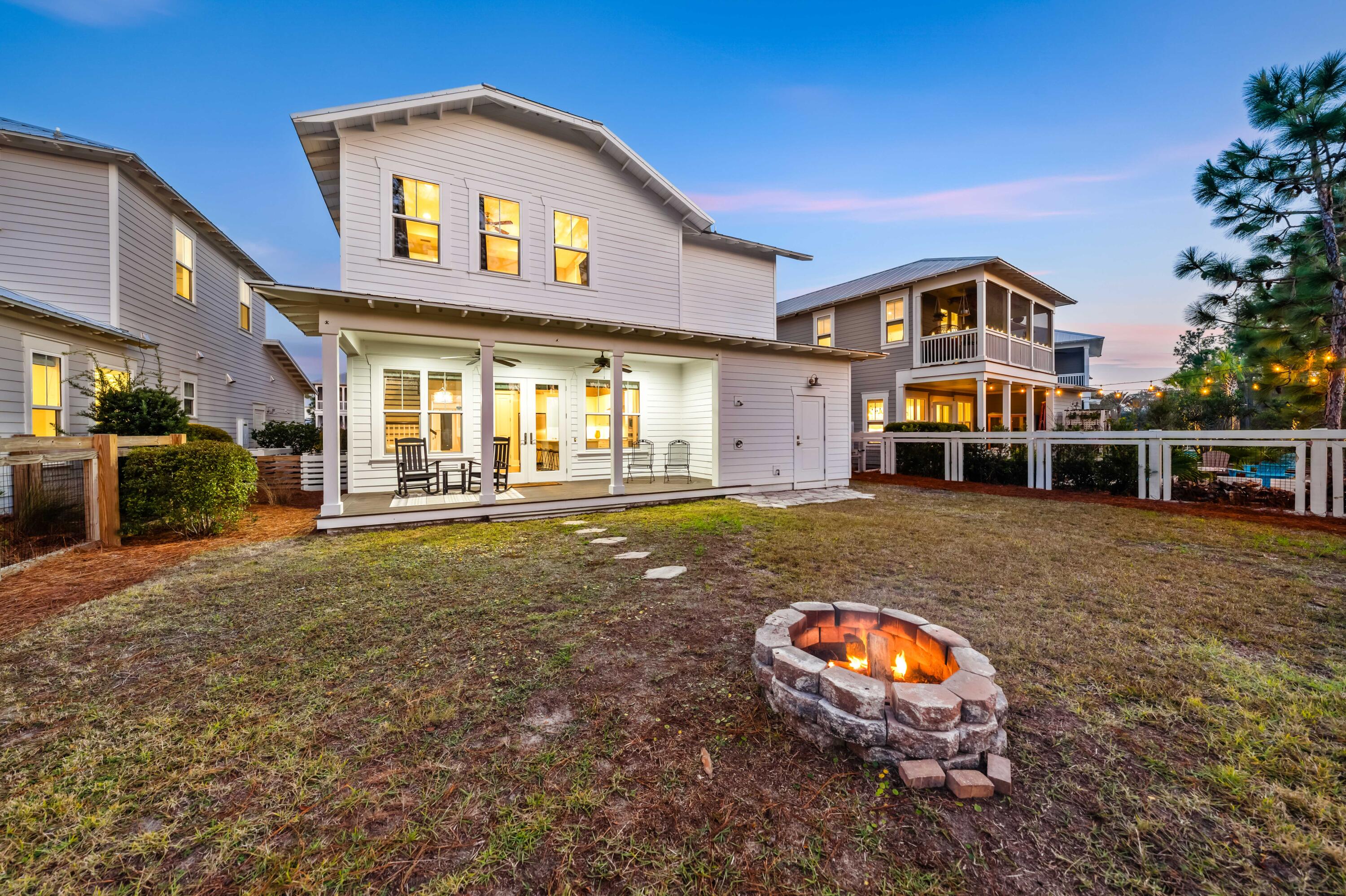 1085 Sandgrass Boulevard Santa Rosa Beach, FL 32459 - Photo 43 of 62 a view of a house with a backyard