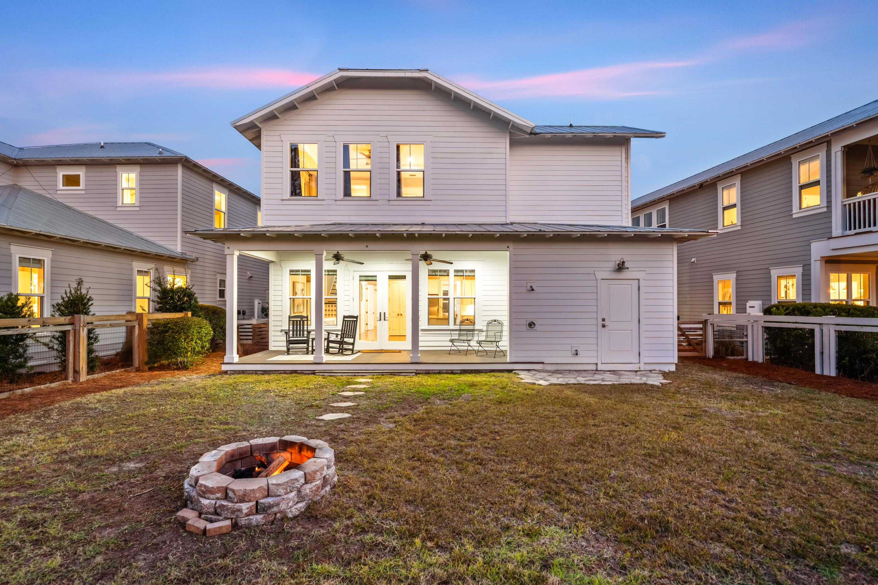 1085 Sandgrass Boulevard Santa Rosa Beach, FL 32459 - Photo 46 of 62 a front view of a house with a yard
