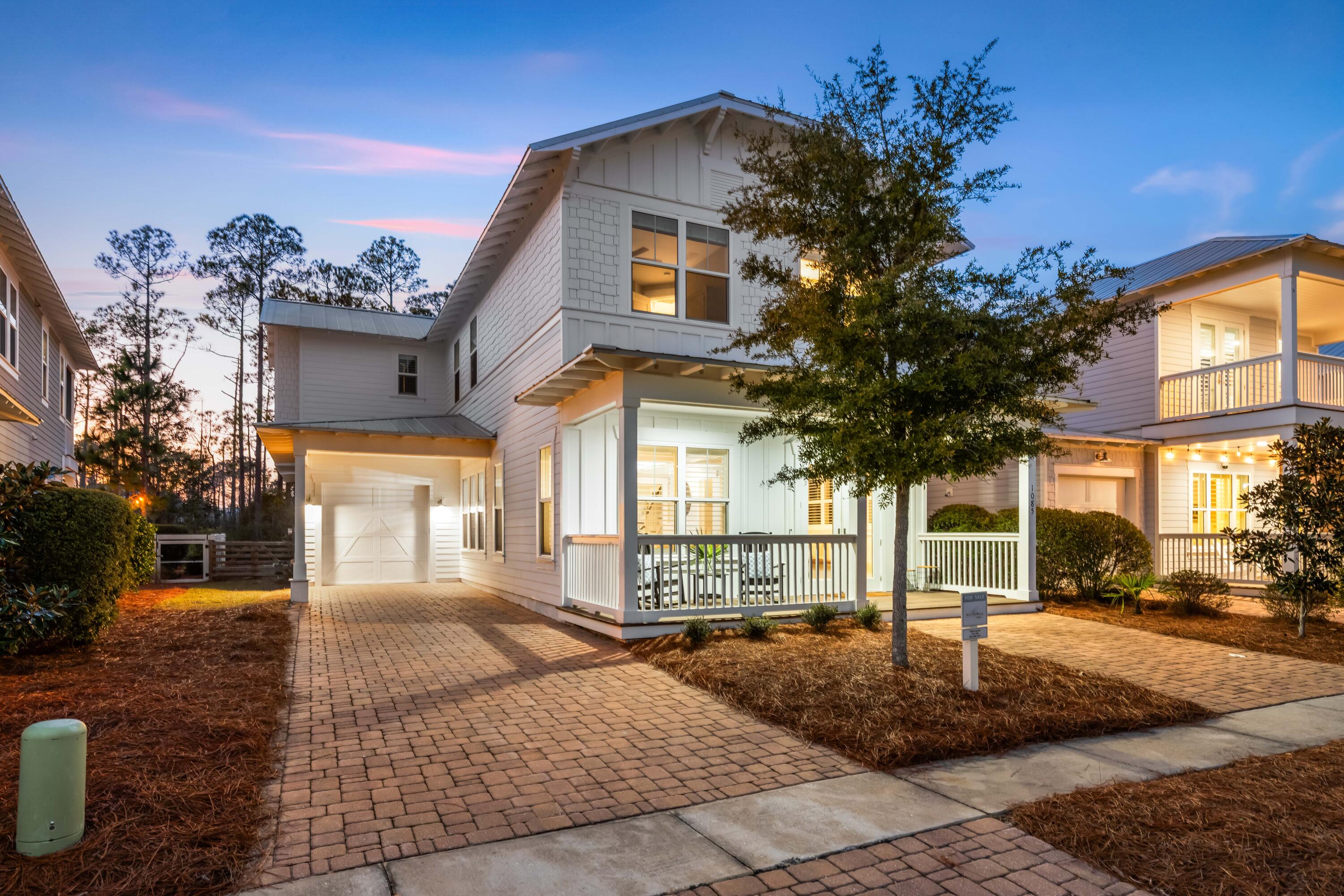1085 Sandgrass Boulevard Santa Rosa Beach, FL 32459 - Photo 54 of 62 a front view of a house with a yard