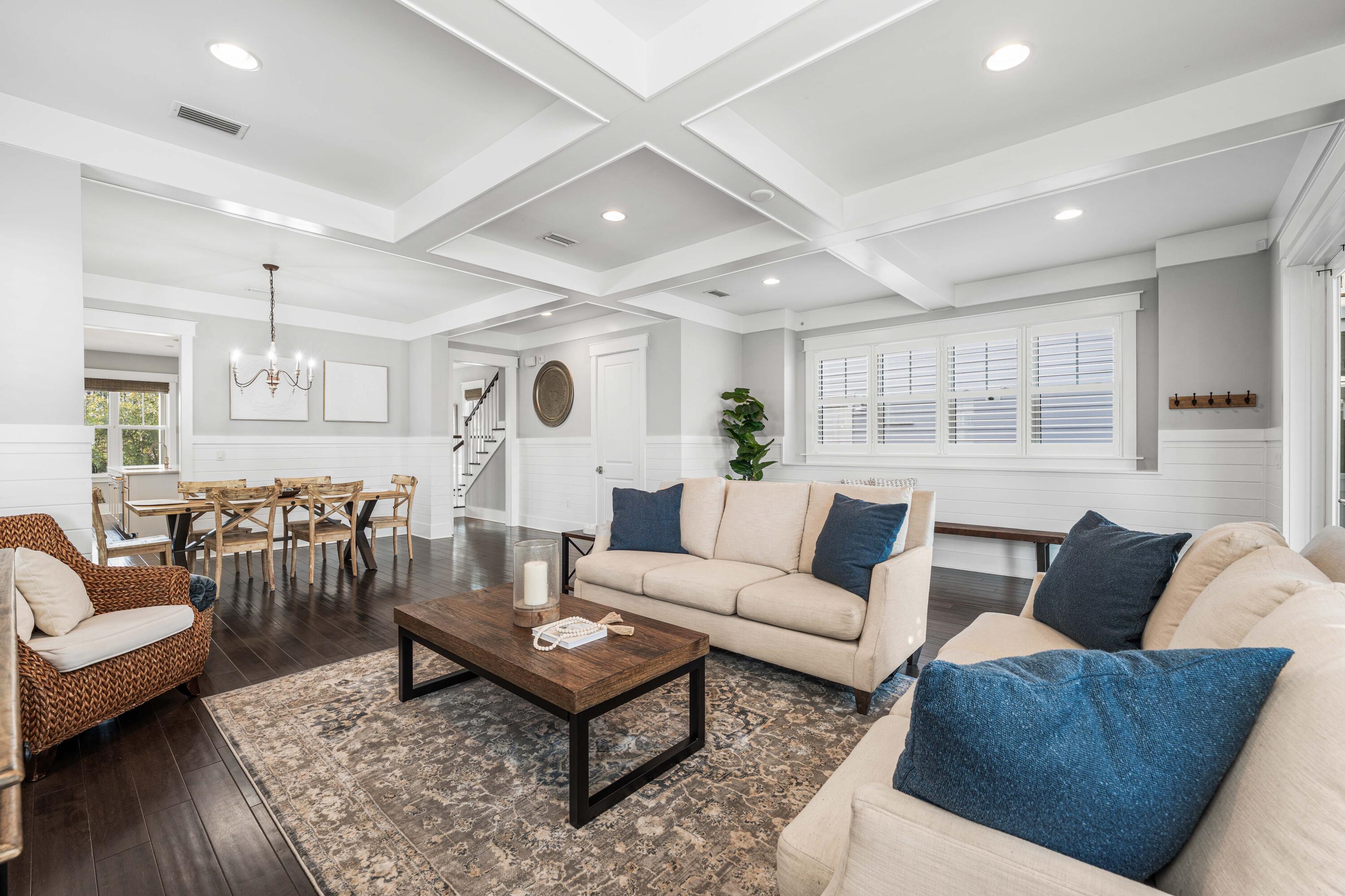 1085 Sandgrass Boulevard Santa Rosa Beach, FL 32459 - Photo 6 of 62 a living room with furniture and wooden floor