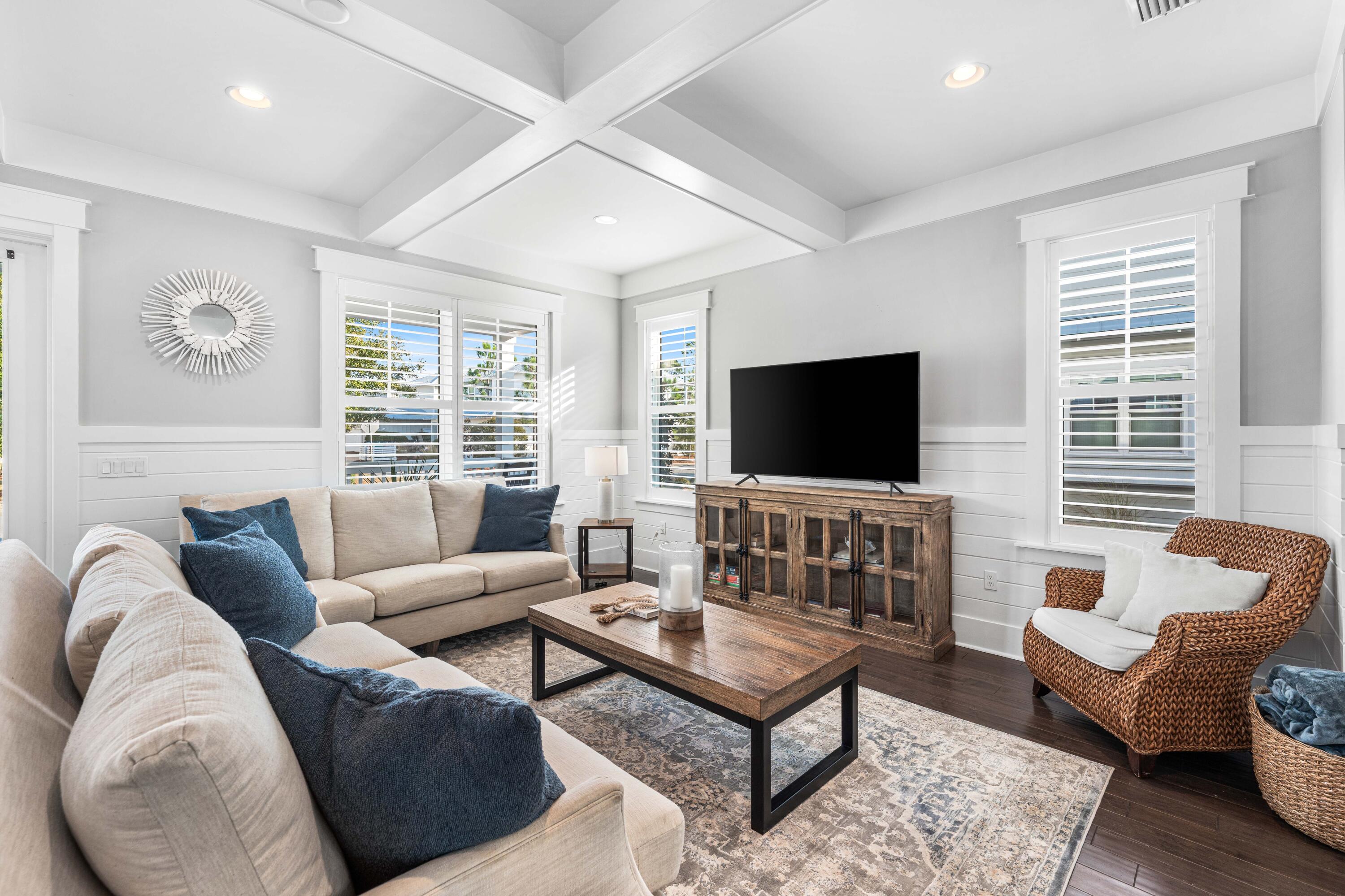 1085 Sandgrass Boulevard Santa Rosa Beach, FL 32459 - Photo 7 of 62 a living room with furniture and a flat screen tv
