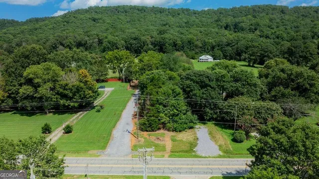 an aerial view of a houses with a yard
