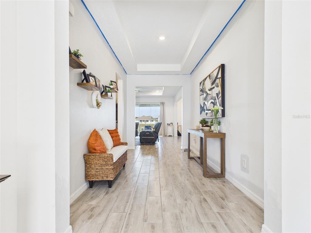 6224 Southwest 74th Ter Road Ocala, FL 34474 - Photo 11 of 52 a living room with furniture and a wooden floor