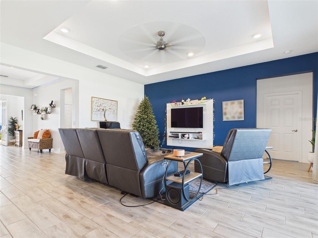 6224 Southwest 74th Ter Road Ocala, FL 34474 - Photo 13 of 52 a living room with furniture and a flat screen tv