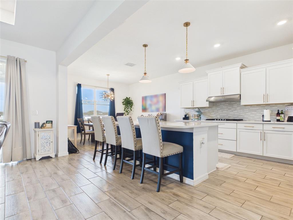 6224 Southwest 74th Ter Road Ocala, FL 34474 - Photo 15 of 52 a large kitchen with a table and chairs