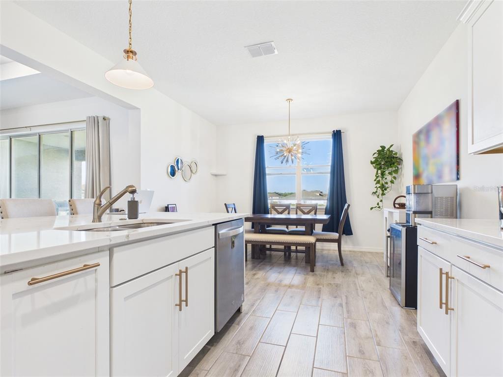 6224 Southwest 74th Ter Road Ocala, FL 34474 - Photo 22 of 52 a kitchen with a sink stove and cabinets