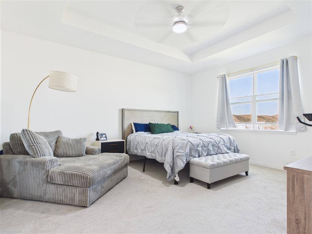 6224 Southwest 74th Ter Road Ocala, FL 34474 - Photo 27 of 52 a bedroom with a bed and a couch