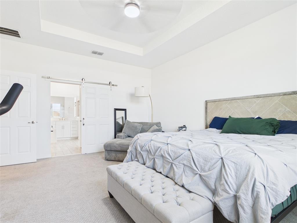 6224 Southwest 74th Ter Road Ocala, FL 34474 - Photo 28 of 52 a bedroom with a bed and a couch