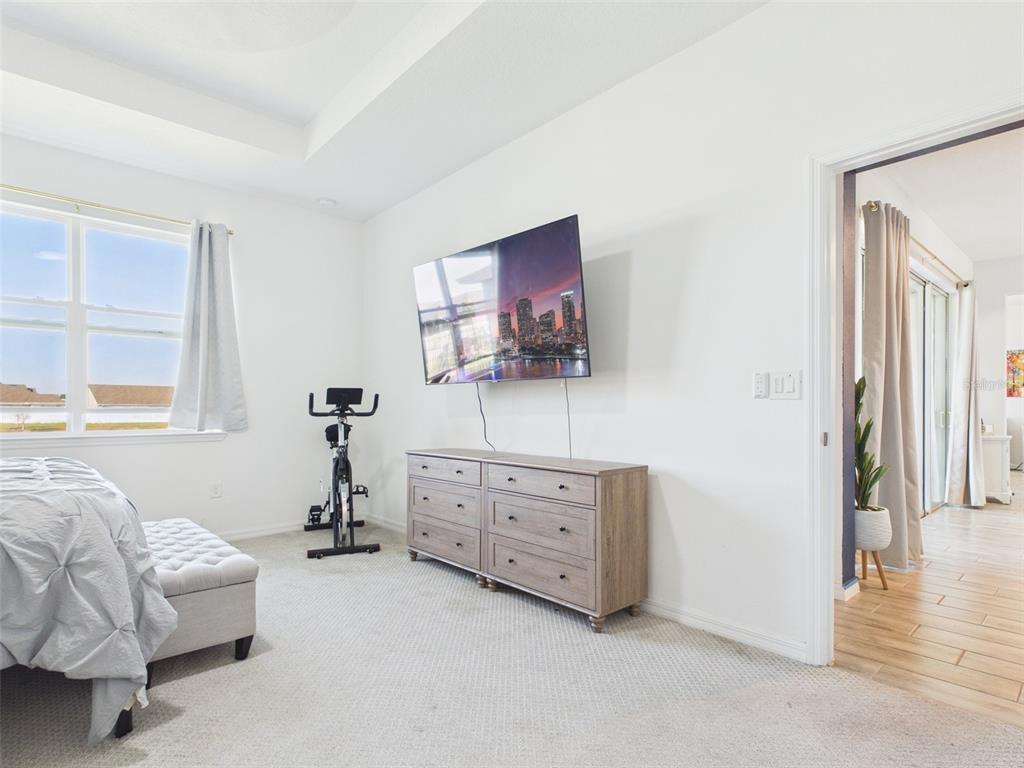 6224 Southwest 74th Ter Road Ocala, FL 34474 - Photo 29 of 52 a bedroom with furniture and a flat screen tv