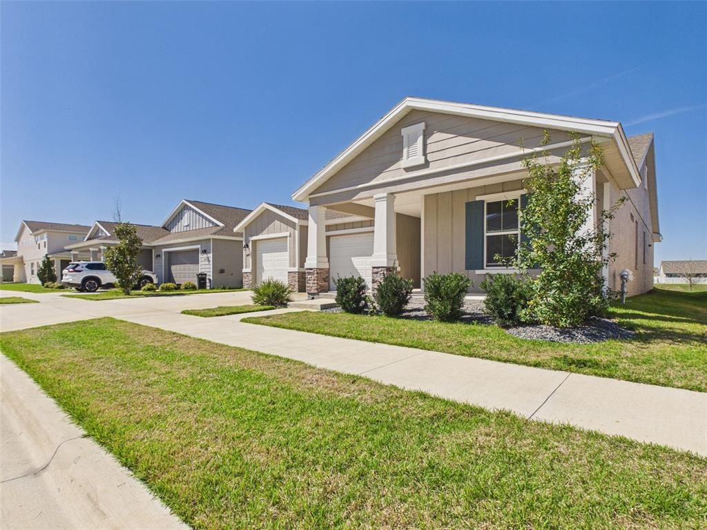 6224 Southwest 74th Ter Road Ocala, FL 34474 - Photo 3 of 52 a front view of a house with a yard