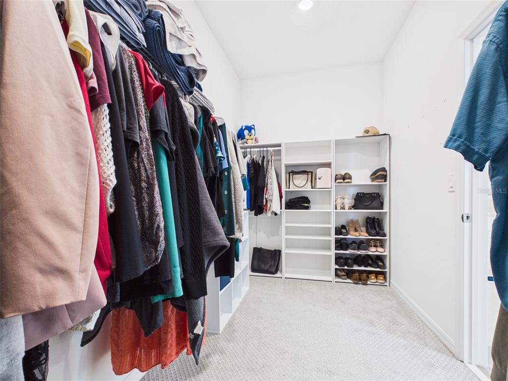 6224 Southwest 74th Ter Road Ocala, FL 34474 - Photo 36 of 52 a view of walk in closet with clothes and shoes
