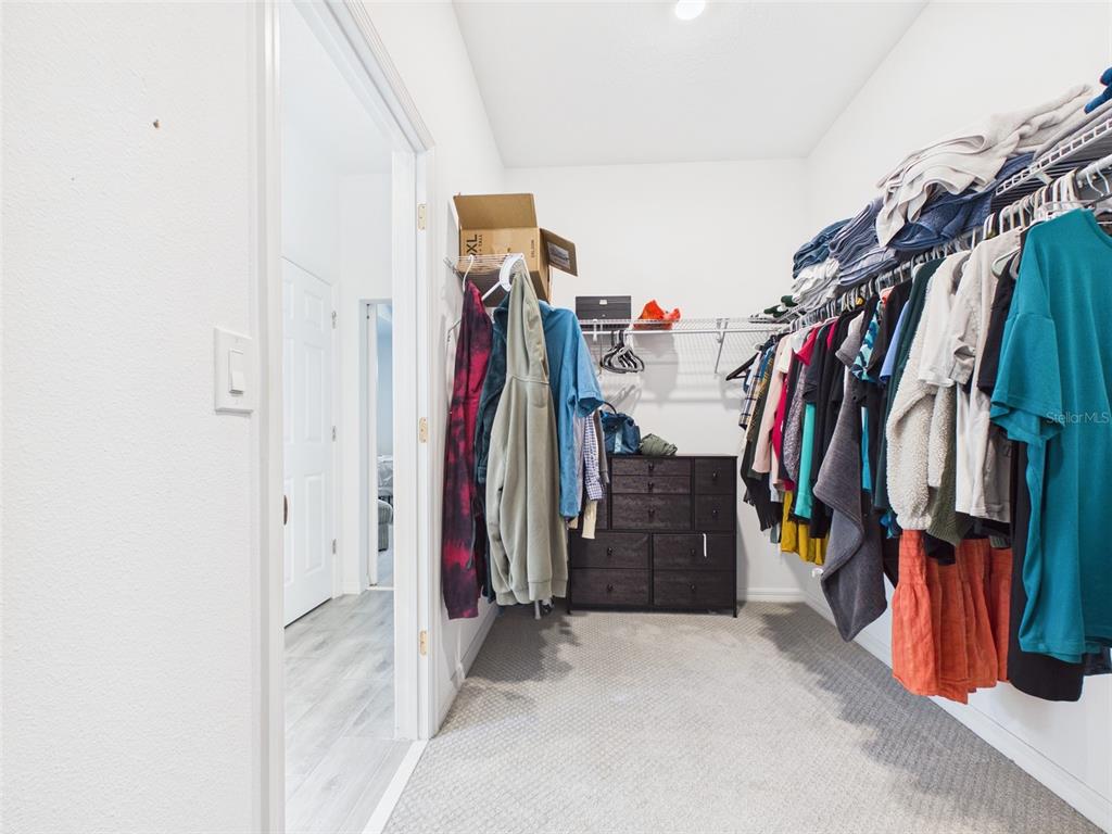 6224 Southwest 74th Ter Road Ocala, FL 34474 - Photo 37 of 52 a view of walk in closet with clothes