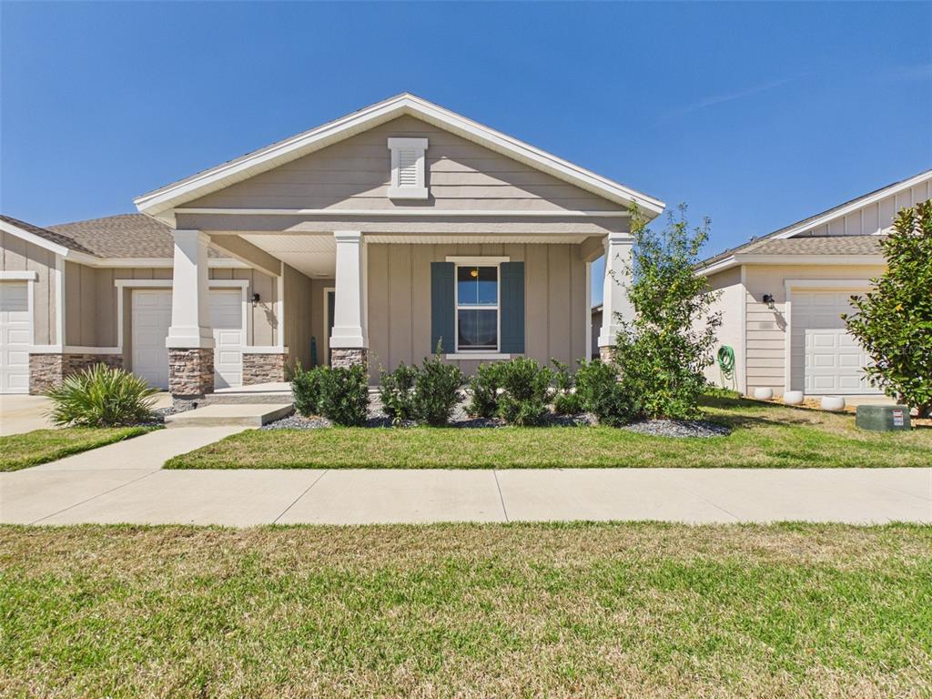 6224 Southwest 74th Ter Road Ocala, FL 34474 - Photo 4 of 52 front view of a house with a yard