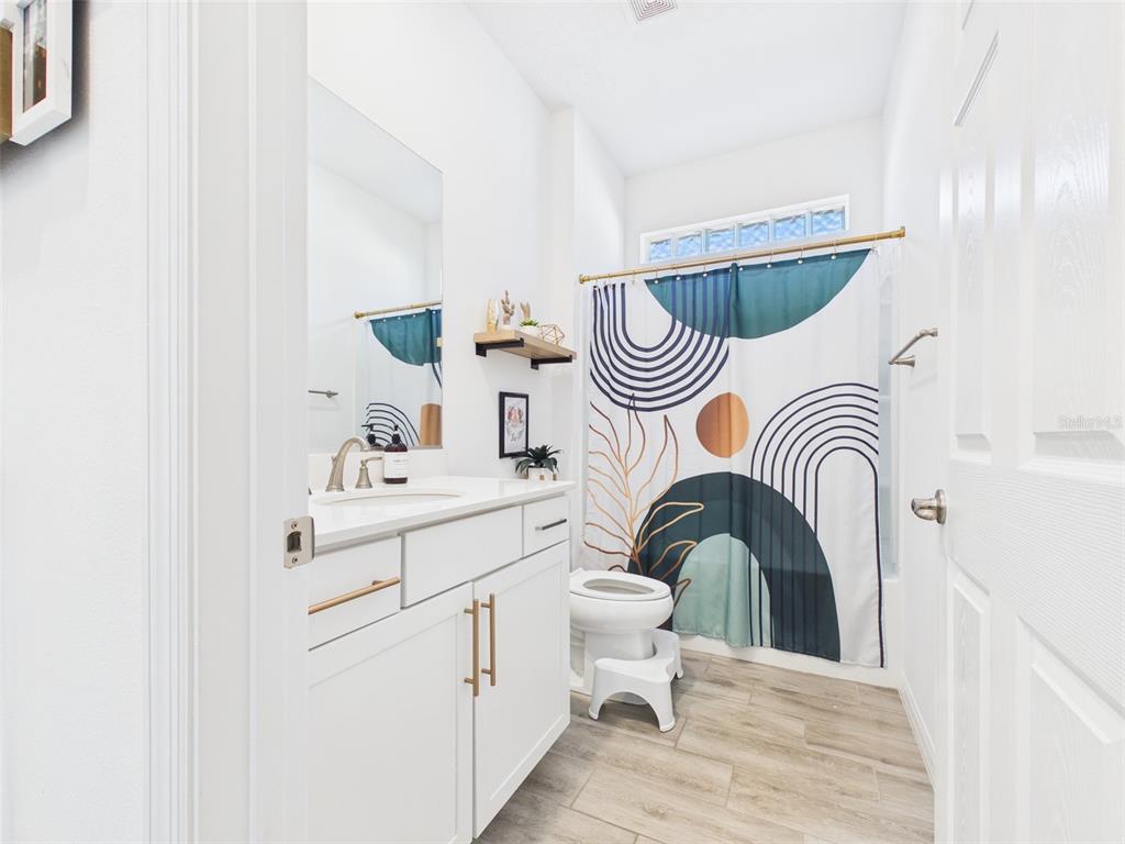 6224 Southwest 74th Ter Road Ocala, FL 34474 - Photo 42 of 52 a bathroom with a sink a bathtub and a mirror