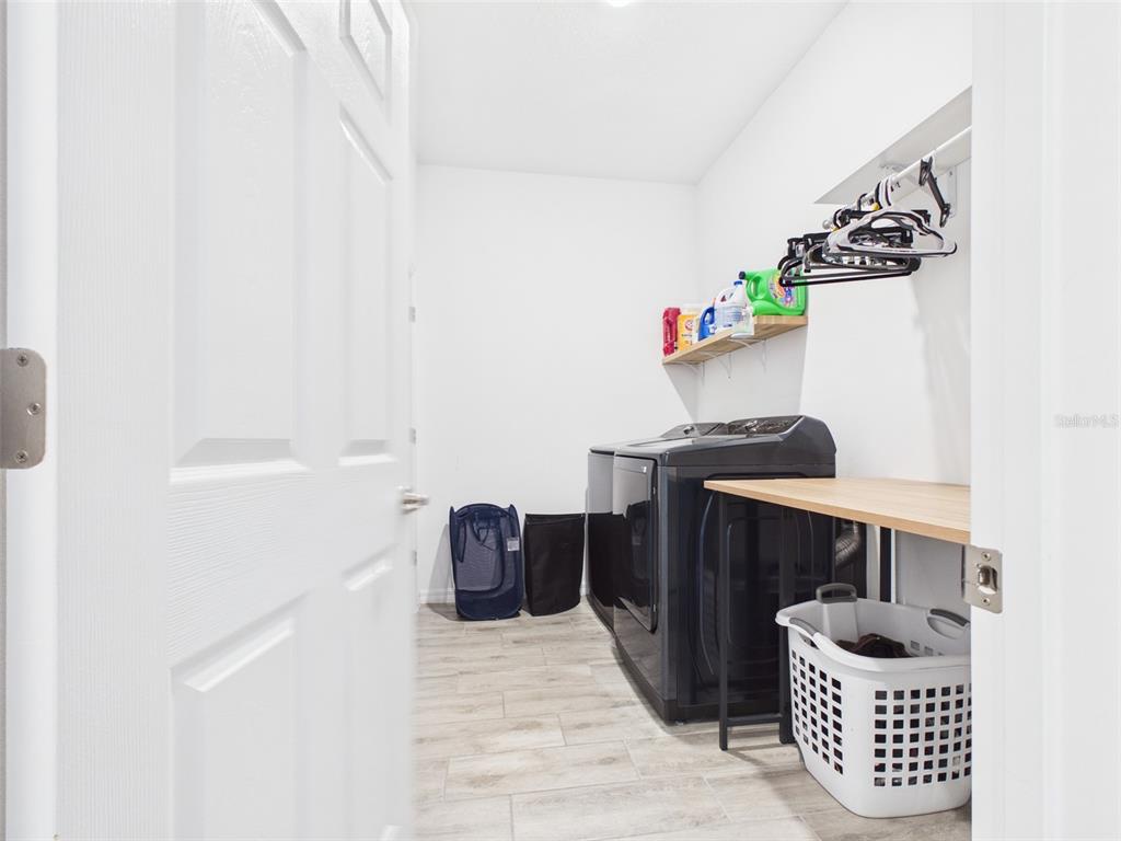 6224 Southwest 74th Ter Road Ocala, FL 34474 - Photo 46 of 52 a kitchen with granite countertop a sink and a stove