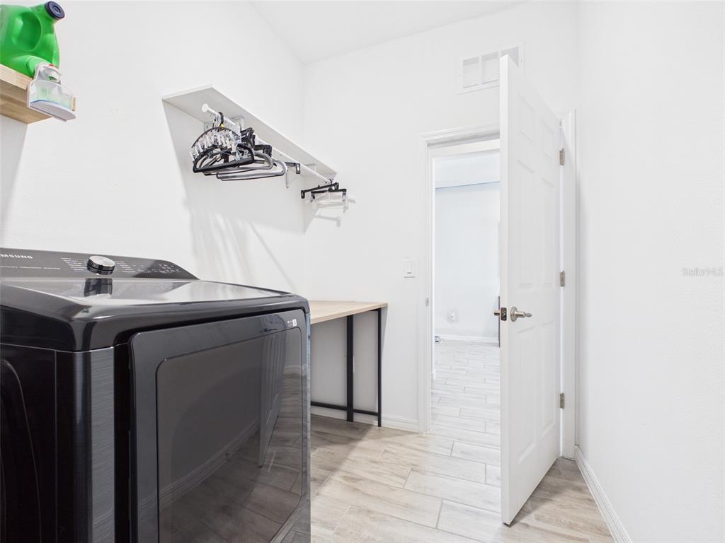 6224 Southwest 74th Ter Road Ocala, FL 34474 - Photo 47 of 52 a utility room with dryer and washer