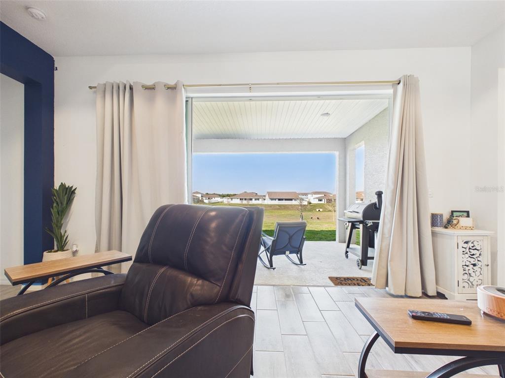 6224 Southwest 74th Ter Road Ocala, FL 34474 - Photo 48 of 52 a living room with furniture and a window