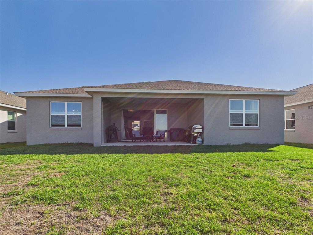 6224 Southwest 74th Ter Road Ocala, FL 34474 - Photo 51 of 52 a backyard of a house with lots of green space