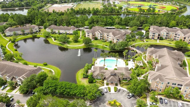 an aerial view of residential house with outdoor space and swimming pool