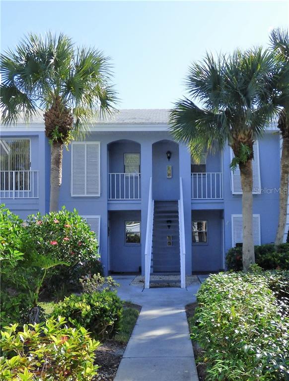 454 Cerromar Road, Unit 174 Venice, FL 34293 - Photo 1 of 1 a front view of a house with a garden
