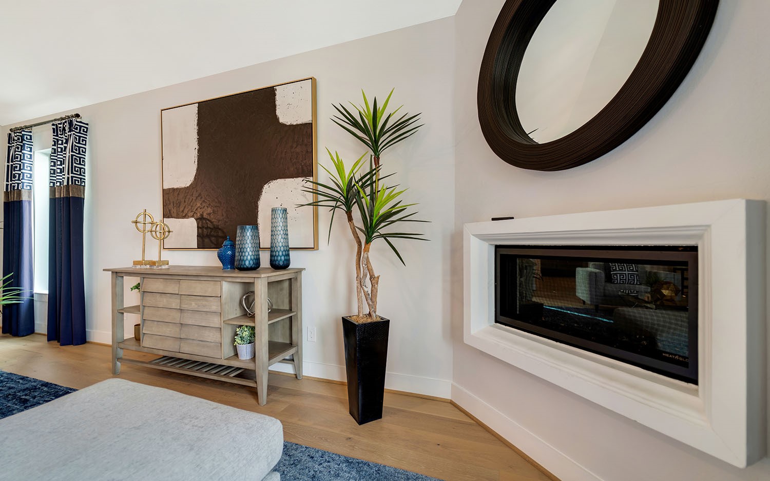 3610 Compass Pointe Court Angleton, TX 77515 - Photo 15 of 27 a kitchen with a fireplace and a potted plant