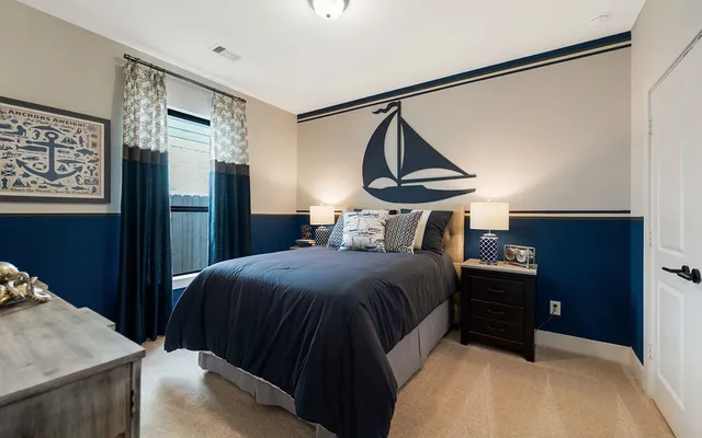 a bedroom with a bed and a dresser