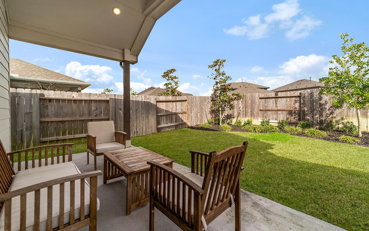 3610 Compass Pointe Court Angleton, TX 77515 - Photo 27 of 27 a view of a house with backyard and porch