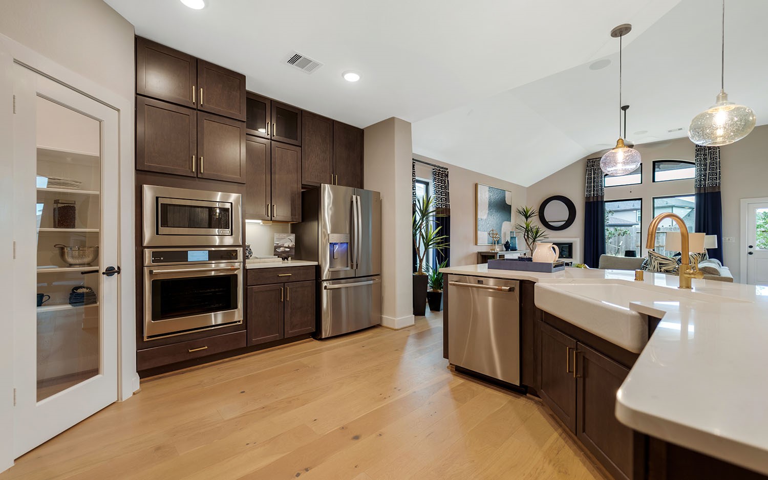 3610 Compass Pointe Court Angleton, TX 77515 - Photo 6 of 27 a kitchen with a sink stainless steel appliances and cabinets