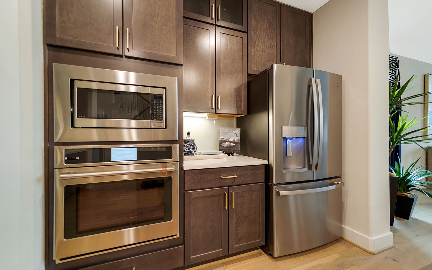 3610 Compass Pointe Court Angleton, TX 77515 - Photo 8 of 27 a kitchen with appliances a microwave and cabinets