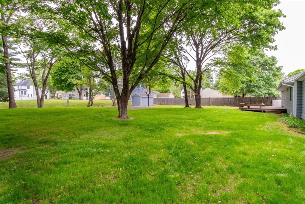 118 Bruce Road Walpole, MA 02081 - Photo 27 of 30 a view of white house in front of a big yard with large trees