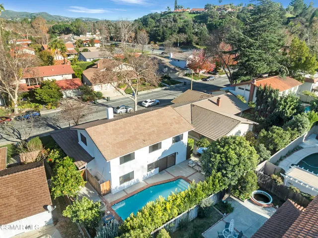 an aerial view of a house with a garden