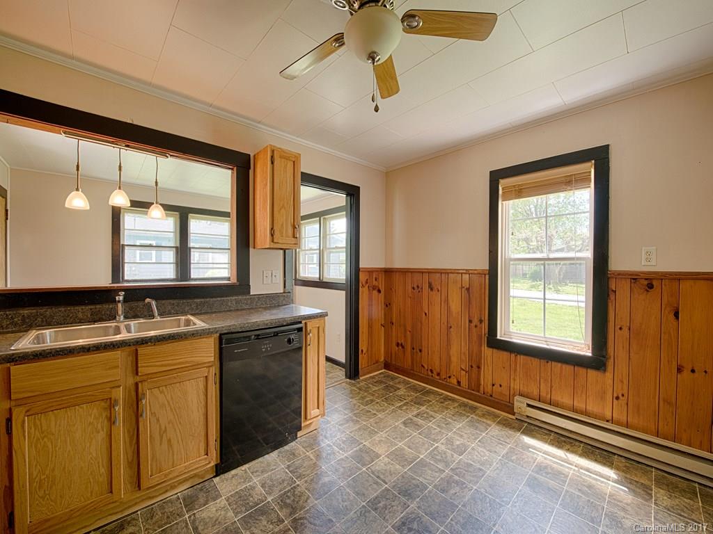 277 Chelsea Road Waynesville, NC 28786 - Photo 14 of 18 a spacious bathroom with a granite countertop sink and a mirror