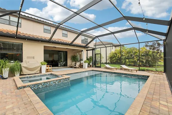 a view of a swimming pool with a patio