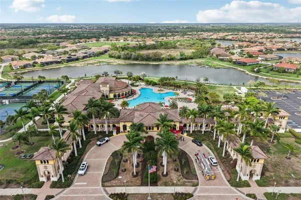 an aerial view of a house with a lake view