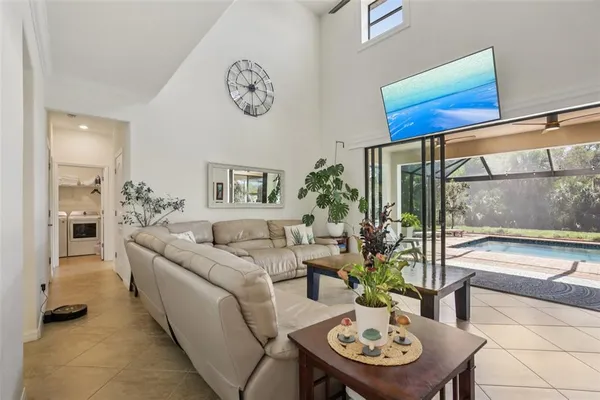 a living room with furniture and a large window