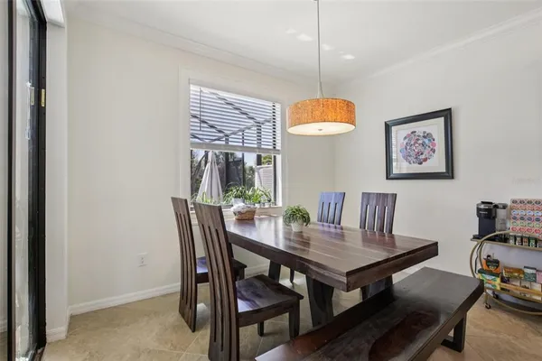 a view of a dining room with furniture wooden floor and chandelier